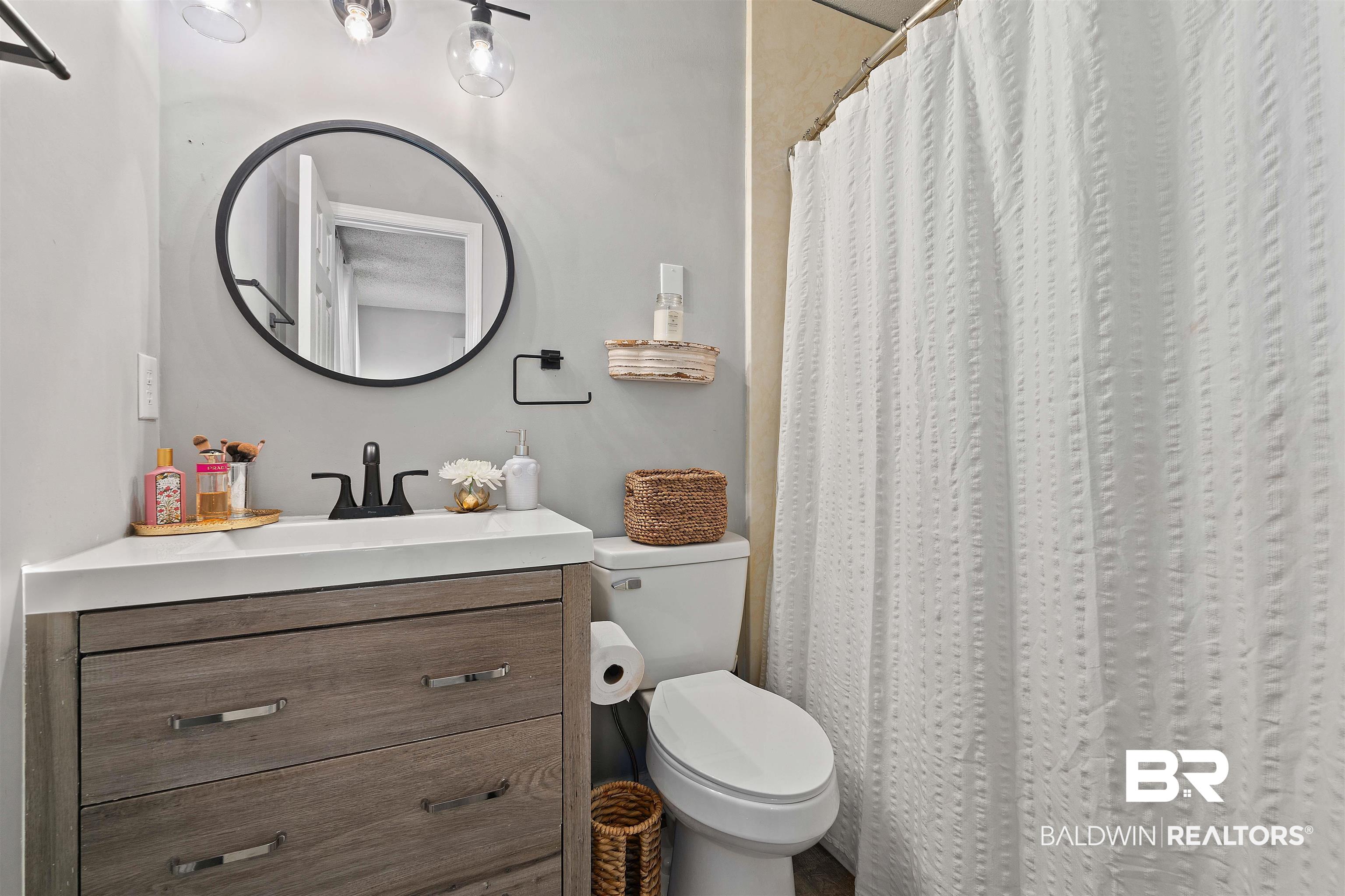 4682 Opal Drive Mobile, AL 36619 - Photo 14 of 27 Bathroom featuring toilet and vanity