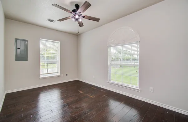 a view of an empty room with a window