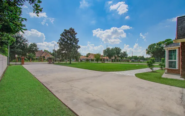 a view of a house with a small yard