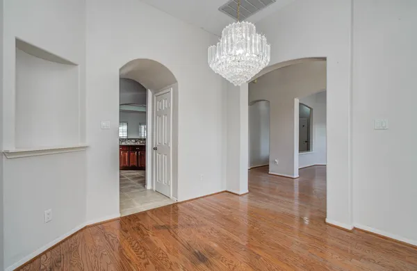 a kitchen with stainless steel appliances granite countertop wooden cabinets and sink