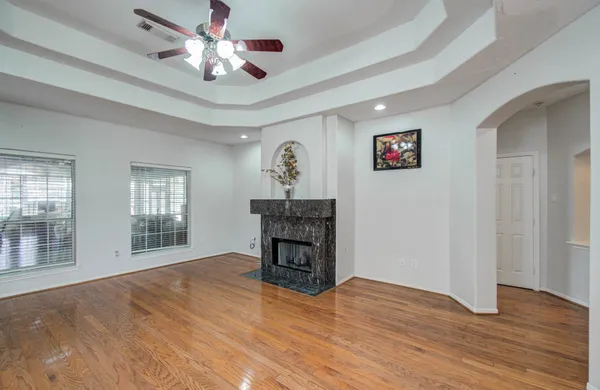 a bathroom with a granite countertop sink a mirror and a shower