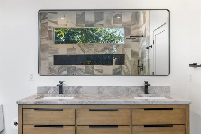 a bathroom with a sink and a mirror