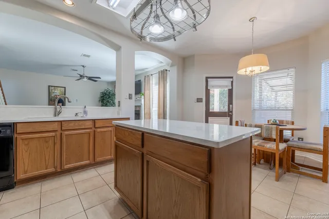 a kitchen with a sink and cabinets