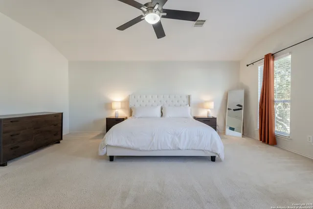 a bedroom with a bed and window