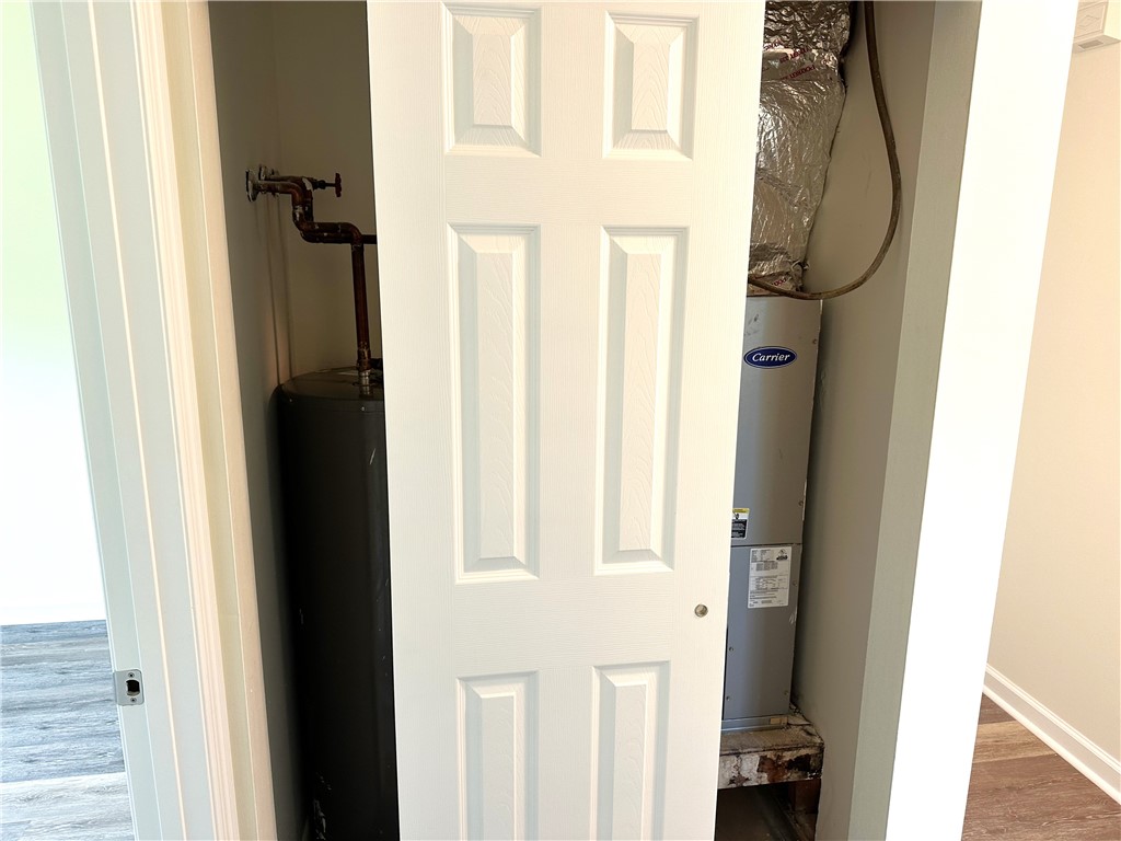 1 Ogden Street, Unit 4 Jekyll Island, GA 31527 - Photo 12 of 25 utility closet with new a/c and water heater