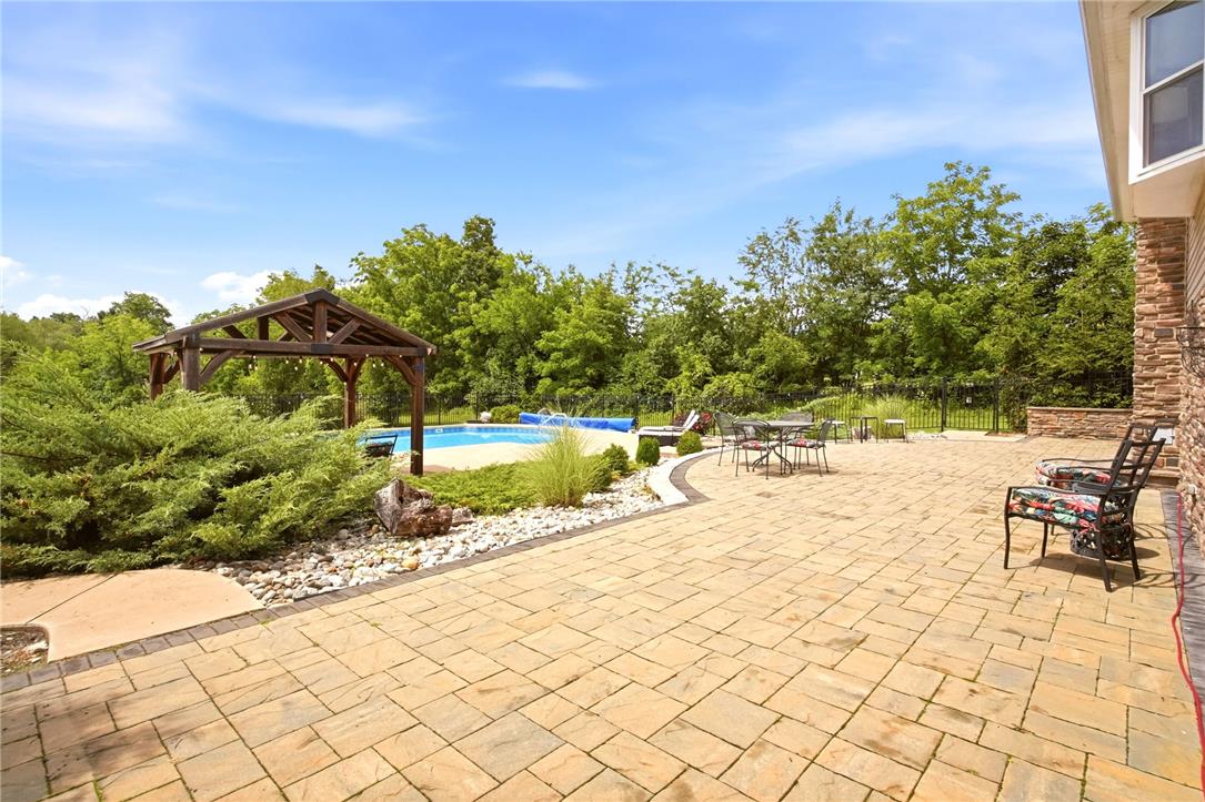 463 North Penn Dixie Road Bath, PA 18014 - Photo 56 of 86 An inviting outdoor patio features an in-ground pool, covered gazebo, and ample space for entertaining amidst mature landscaping.
