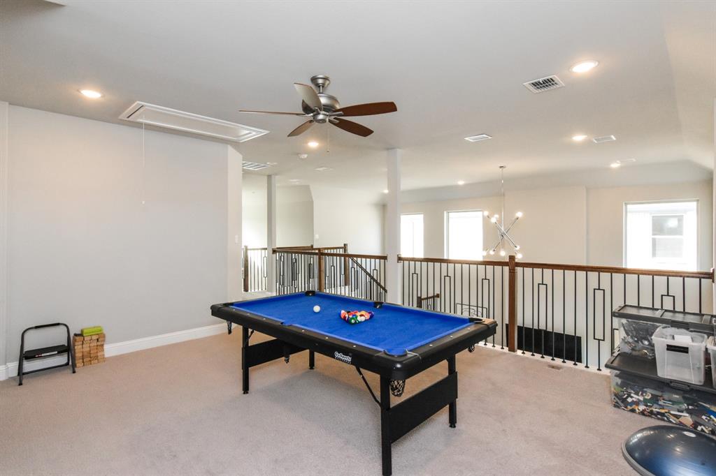 2516 Maidenhair Road Frisco, TX 75033 - Photo 16 of 30 a living room with furniture a table and wooden floor