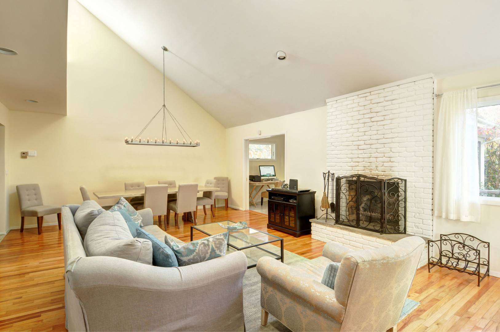 120 Springy Banks Road East Hampton, NY 11937 - Photo 4 of 10 a living room with furniture windows and a fireplace