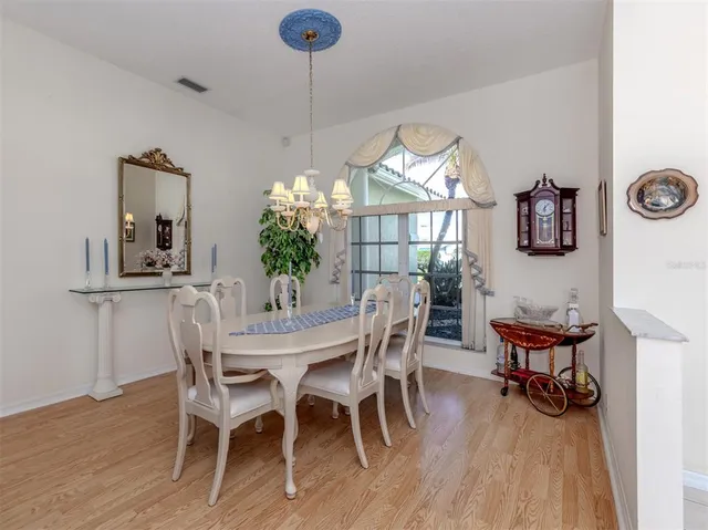 a spacious bedroom with a bed and glass door