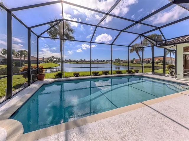 a front view of a house with a yard and potted plants