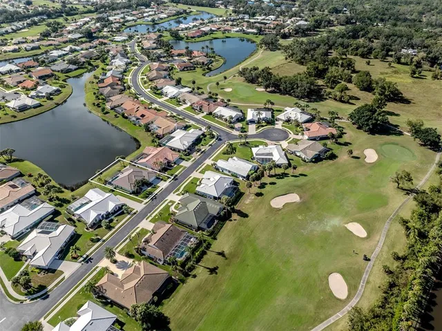 a kitchen with a refrigerator and a dining table