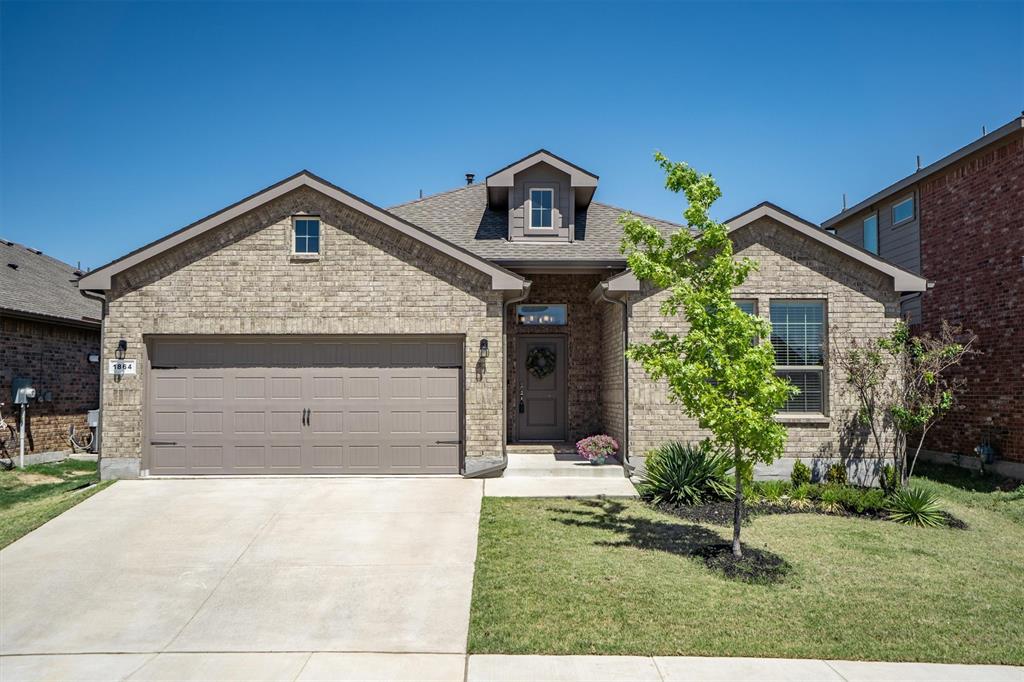 1864 Mensa Drive Haslet, TX 76052 - Photo 2 of 40 a front view of a house with a yard