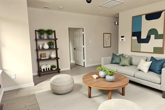 a living room with furniture and a table