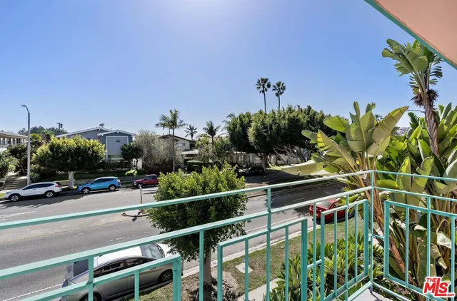 a view of a street with a building in the background