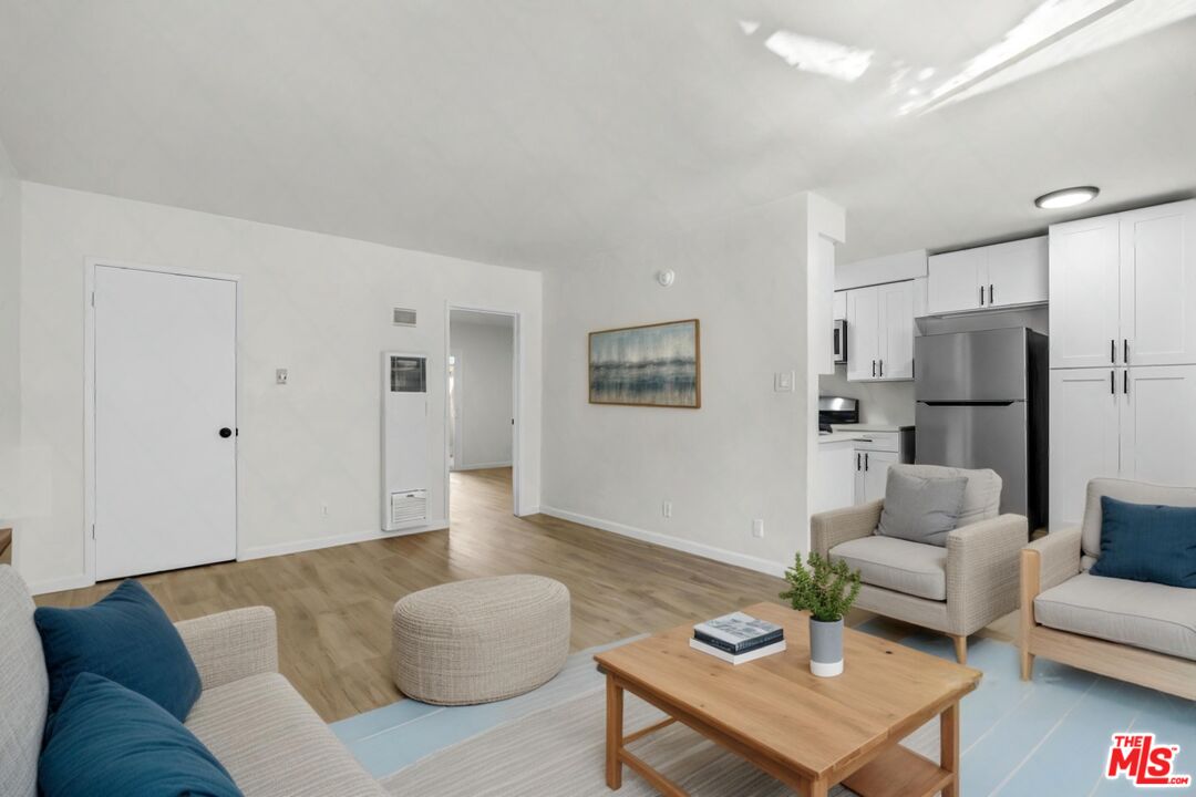 7825 West Manchester Avenue, Unit 28 Playa del Rey, CA 90293 - Photo 6 of 14 a living room with furniture and a couch