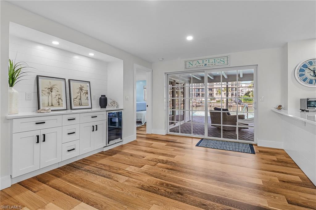 1823 Hurricane Harbor Lane Naples, FL 34102 - Photo 11 of 30 a room with natural light and wooden floor