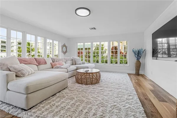 a living room with furniture and windows