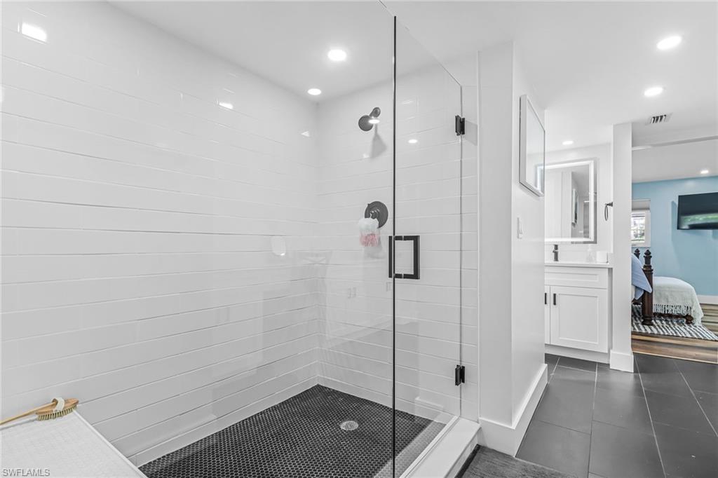 1823 Hurricane Harbor Lane Naples, FL 34102 - Photo 18 of 30 a bathroom with a shower and a sink