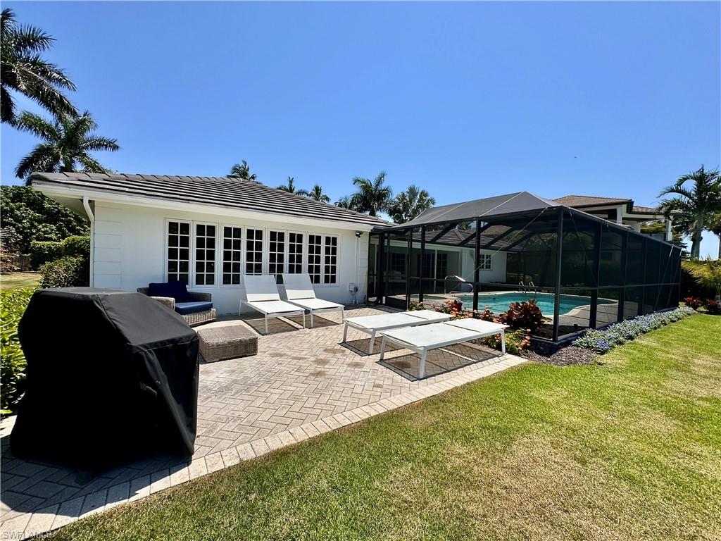 1823 Hurricane Harbor Lane Naples, FL 34102 - Photo 28 of 30 a view of a house with backyard porch and sitting area