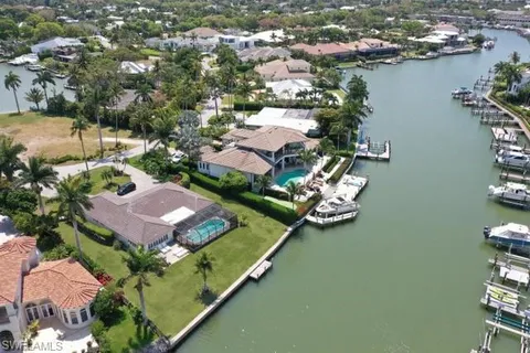 an aerial view of a house with a lake view