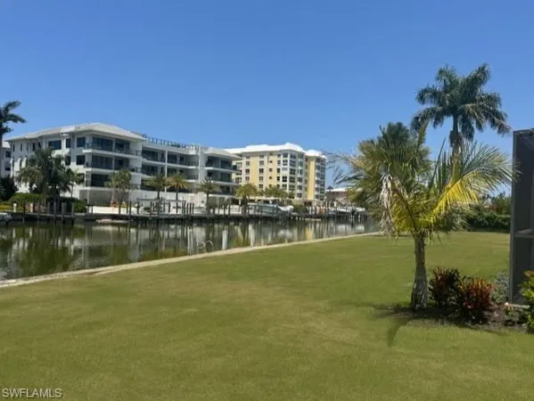 a view of a lake with a building in the background