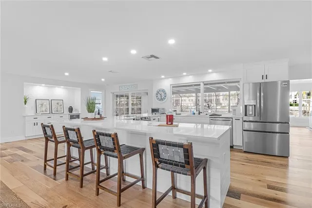 a kitchen with appliances and wooden cabinets