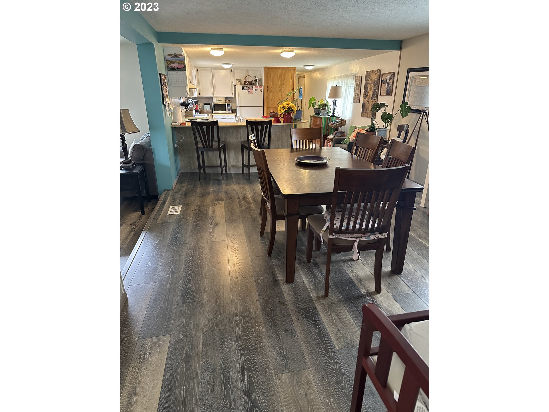 1267 Tucker Road, Unit 3 Hood River, OR 97031 - Photo 8 of 18 a view of a dining room with furniture and wooden floor
