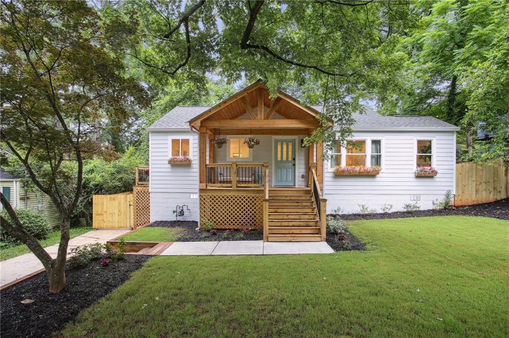 2313 Desmond Drive Decatur, GA 30033 - Photo 1 of 1 a front view of a house with a yard and garage