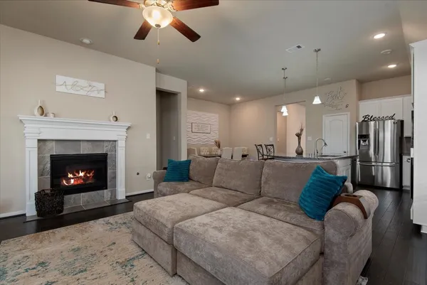 a living room with furniture and a fireplace