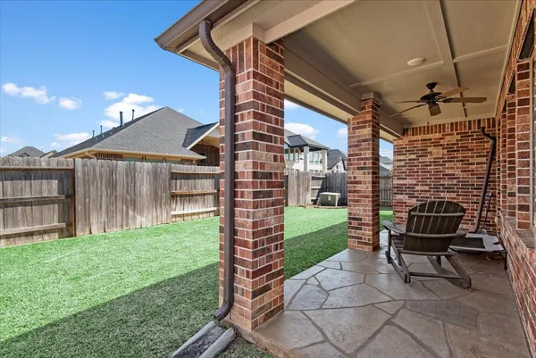 a backyard of a house with seating space