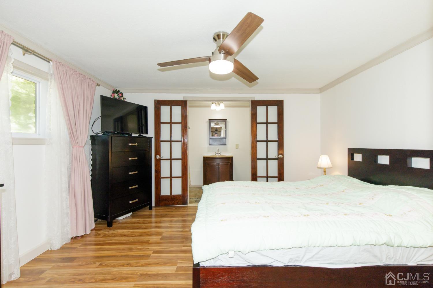 57 Burns Road North Brunswick, NJ 08902 - Photo 4 of 26 a bedroom with a bed and a dresser
