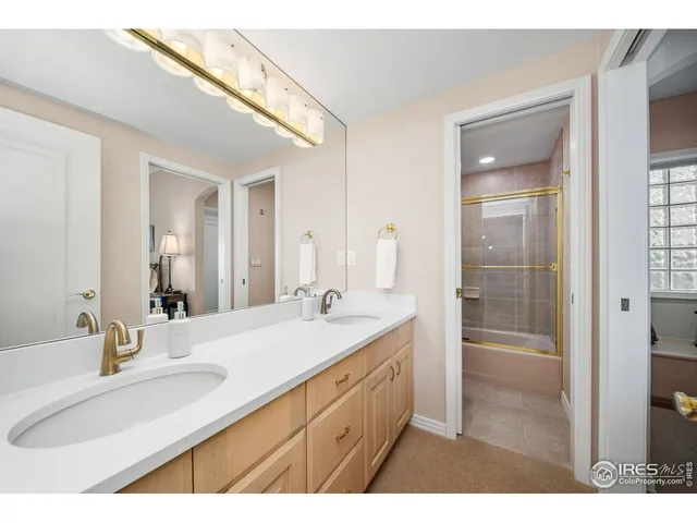 a bathroom with a sink double vanity and a mirror