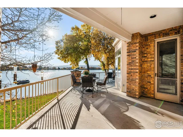 a view of a patio with a table and chairs