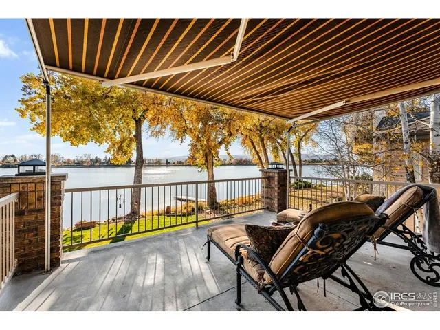 a view of a chairs and table in the balcony