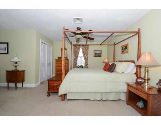 244 East County Road Rutland, MA 01543 - Photo 20 of 30 a bedroom with a bed and a lamp