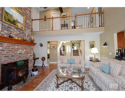 244 East County Road Rutland, MA 01543 - Photo 2 of 30 a living room with furniture a fireplace and a flat screen tv