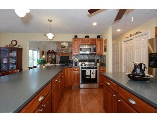 244 East County Road Rutland, MA 01543 - Photo 9 of 30 a kitchen with stainless steel appliances granite countertop a sink a stove and a wooden floors