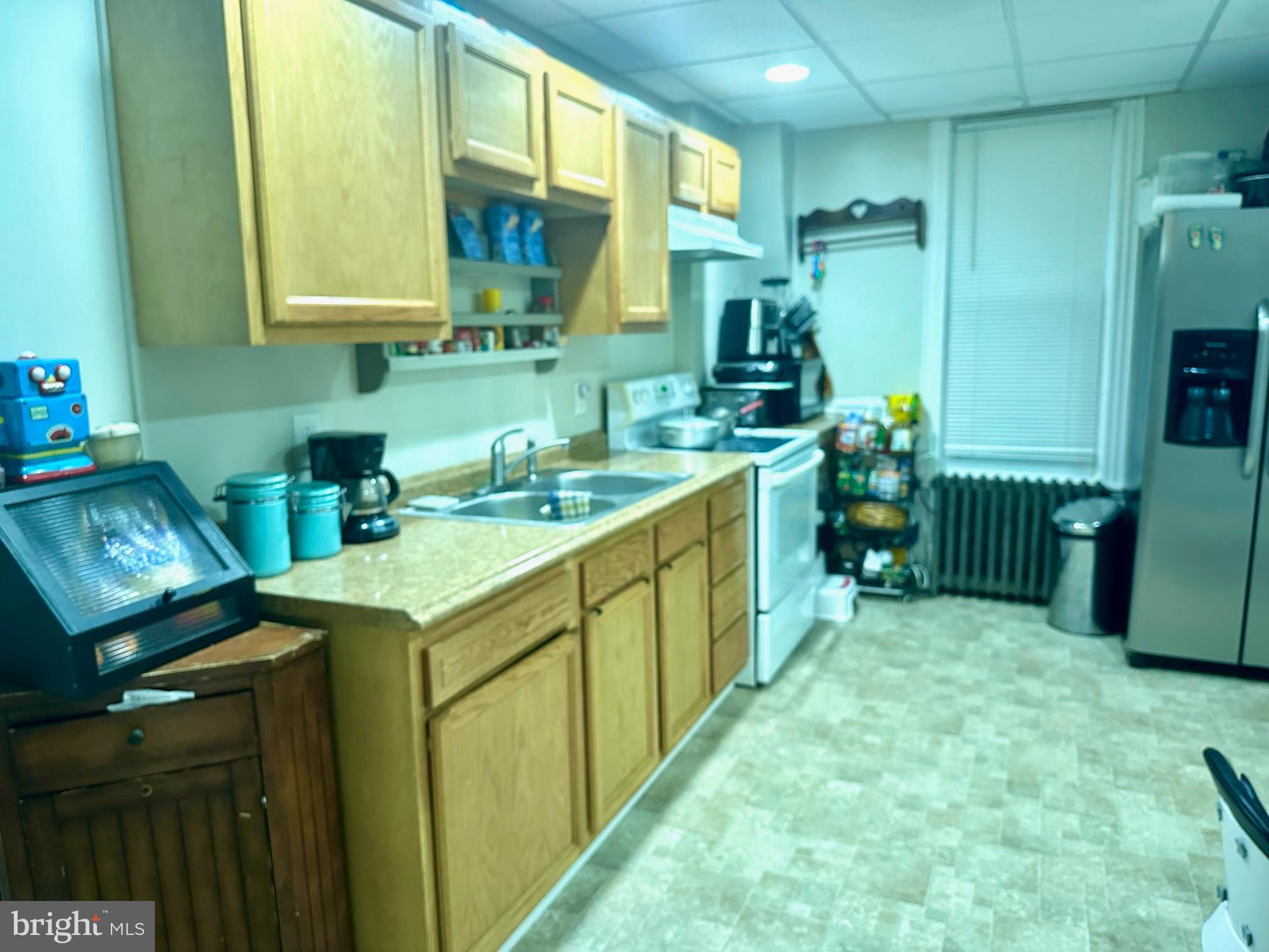 3411 Penn Avenue Sinking Spring, PA 19608 - Photo 8 of 13 a kitchen with sink cabinets and stove