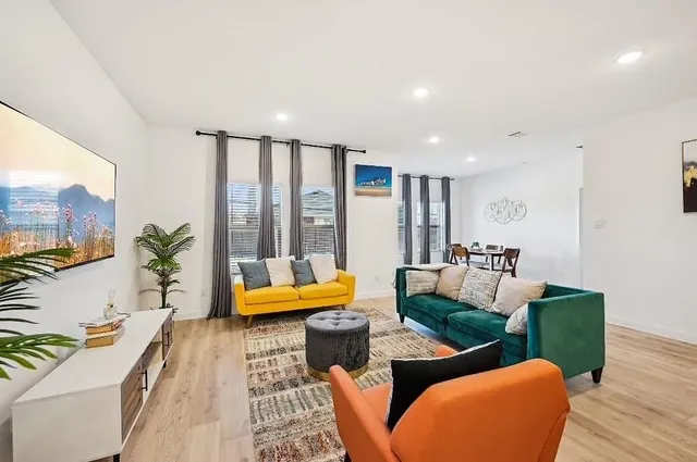 a living room with furniture and a large window
