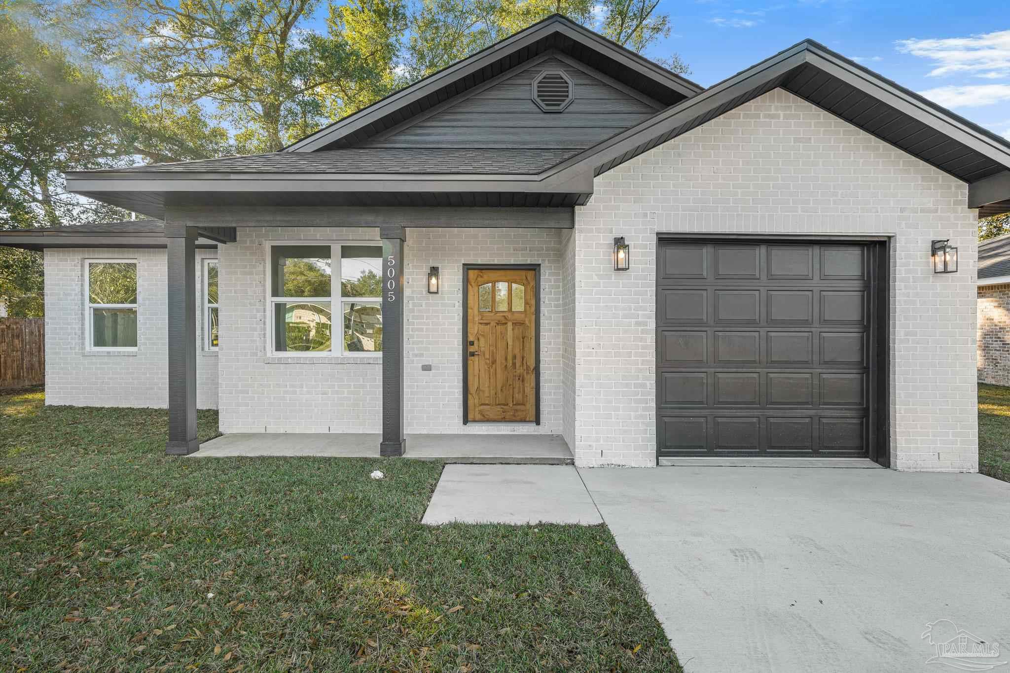 5005 Saufley Field Road Pensacola, FL 32526 - Photo 1 of 27 front view of a house with a yard