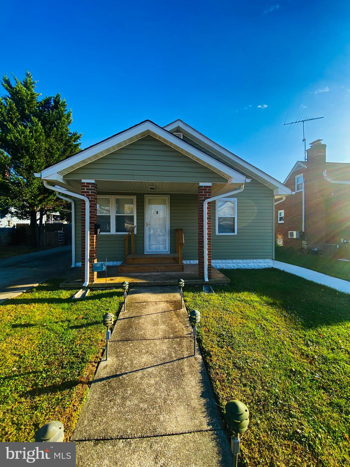 619 Franklin Avenue Baltimore, MD 21221 - Photo 1 of 17 a front view of a house with garden
