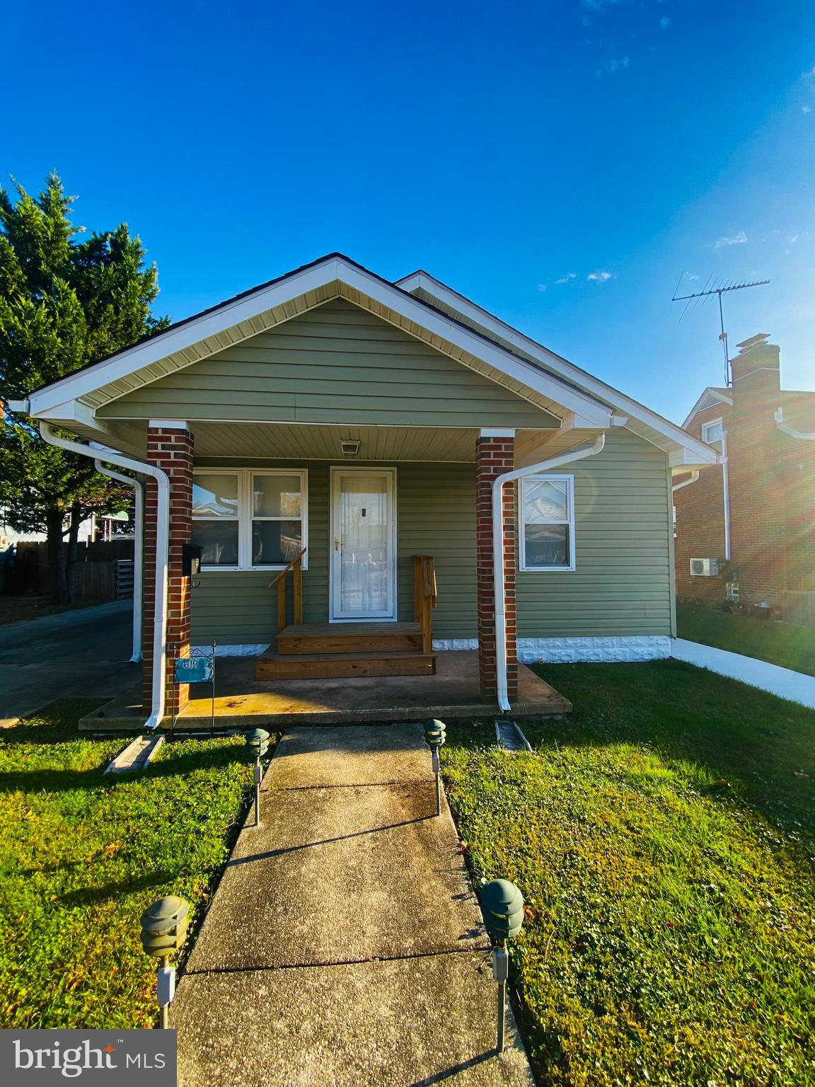 619 Franklin Avenue Baltimore, MD 21221 - Photo 14 of 17 a front view of a house with garden