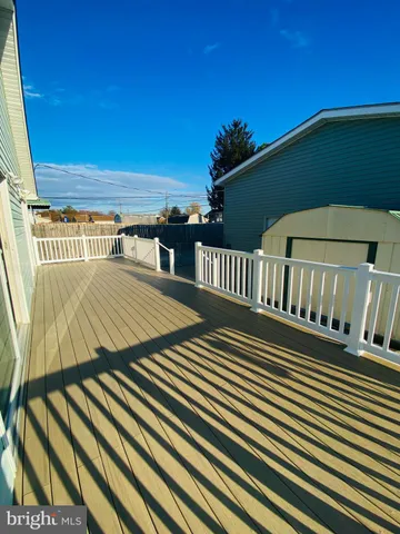 a view of balcony with wooden floor