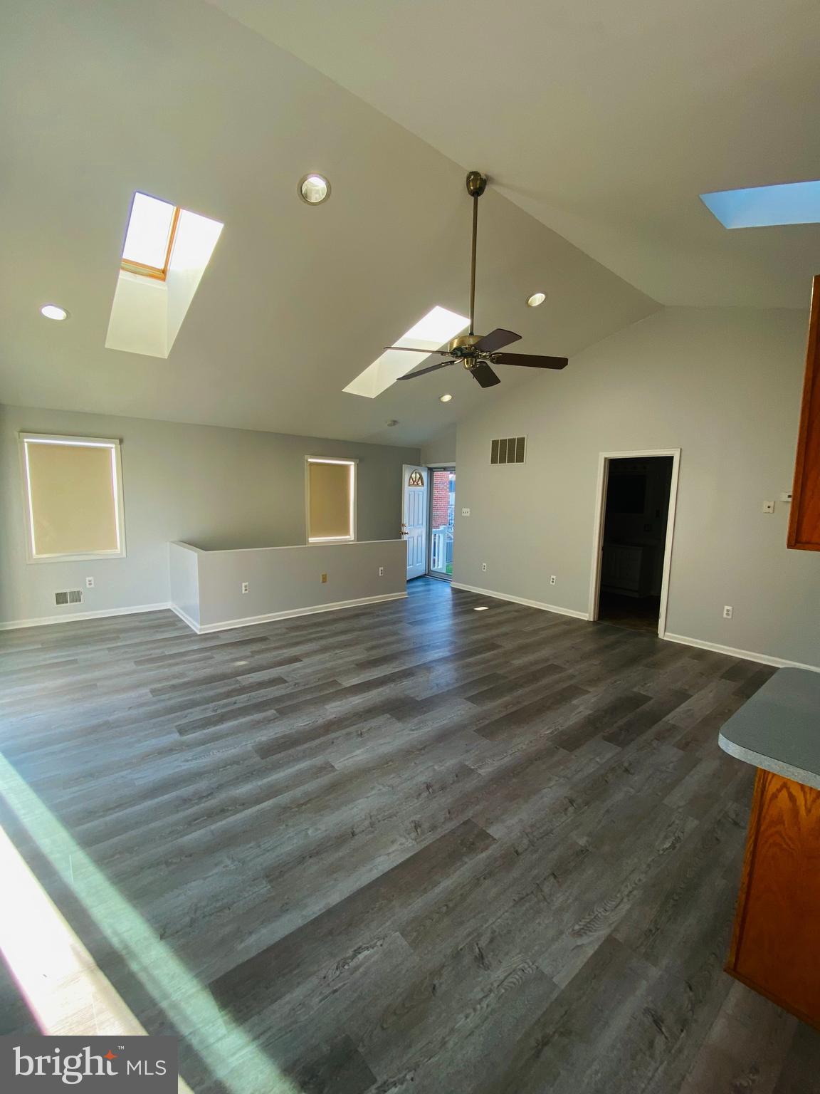 619 Franklin Avenue Baltimore, MD 21221 - Photo 4 of 17 a view of a room with wooden floor