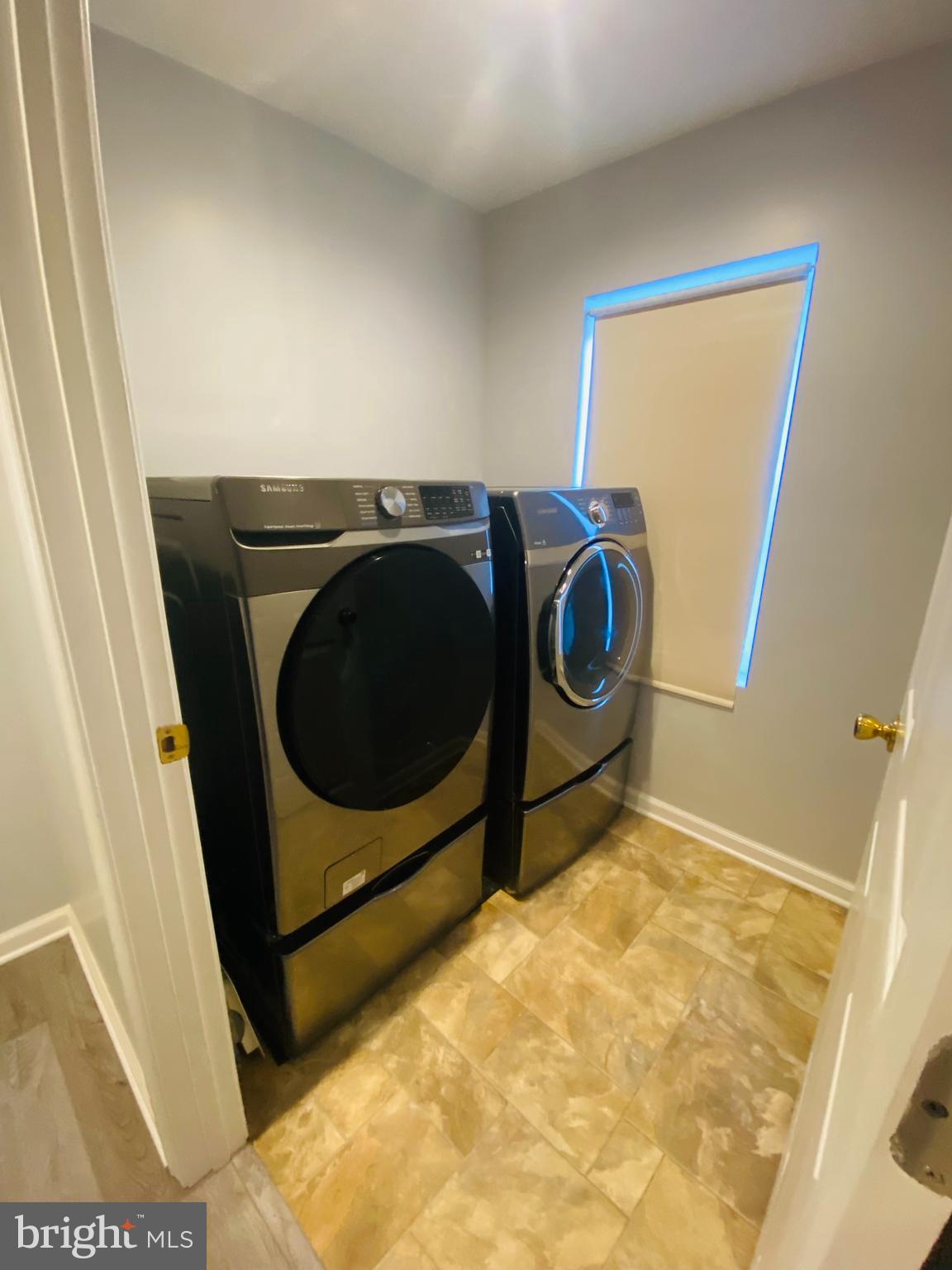 619 Franklin Avenue Baltimore, MD 21221 - Photo 9 of 17 a utility room with dryer and washer