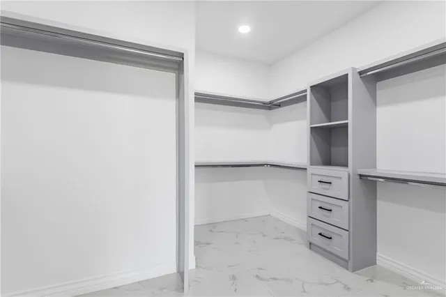 a view of an empty walk in closet