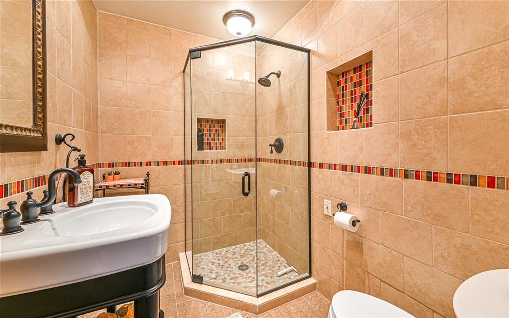 381 Friday Road Pittsburgh, PA 15209 - Photo 20 of 44 a bathroom with a sink a toilet and shower