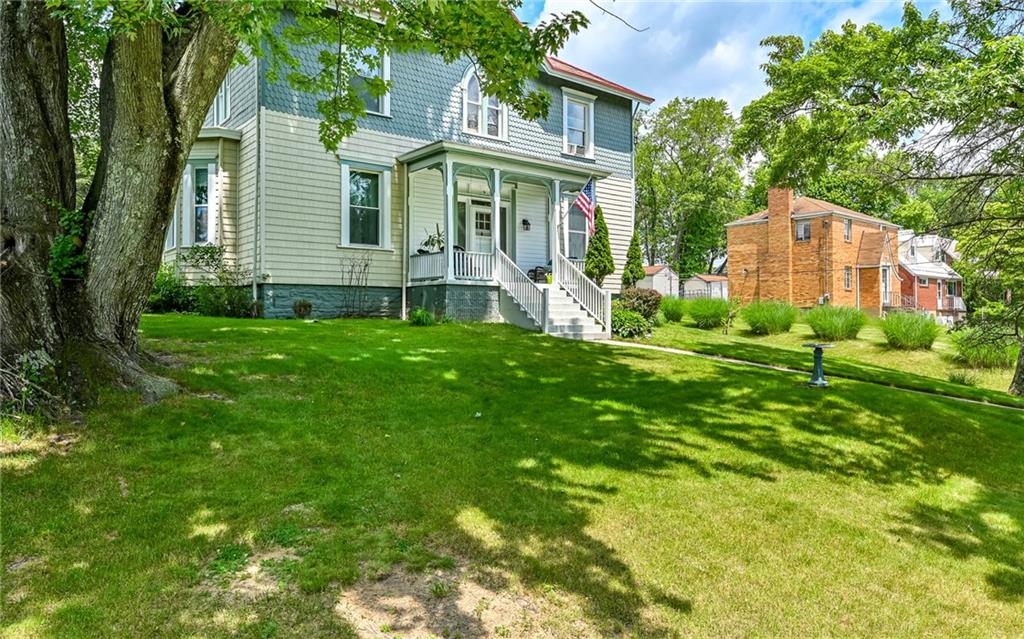 381 Friday Road Pittsburgh, PA 15209 - Photo 2 of 44 a view of a brick house with a big yard and large trees
