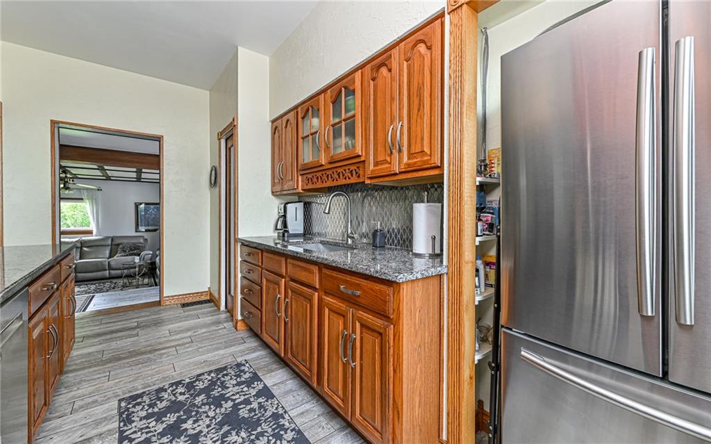 381 Friday Road Pittsburgh, PA 15209 - Photo 27 of 44 a hallway with granite countertop a refrigerator and a sink