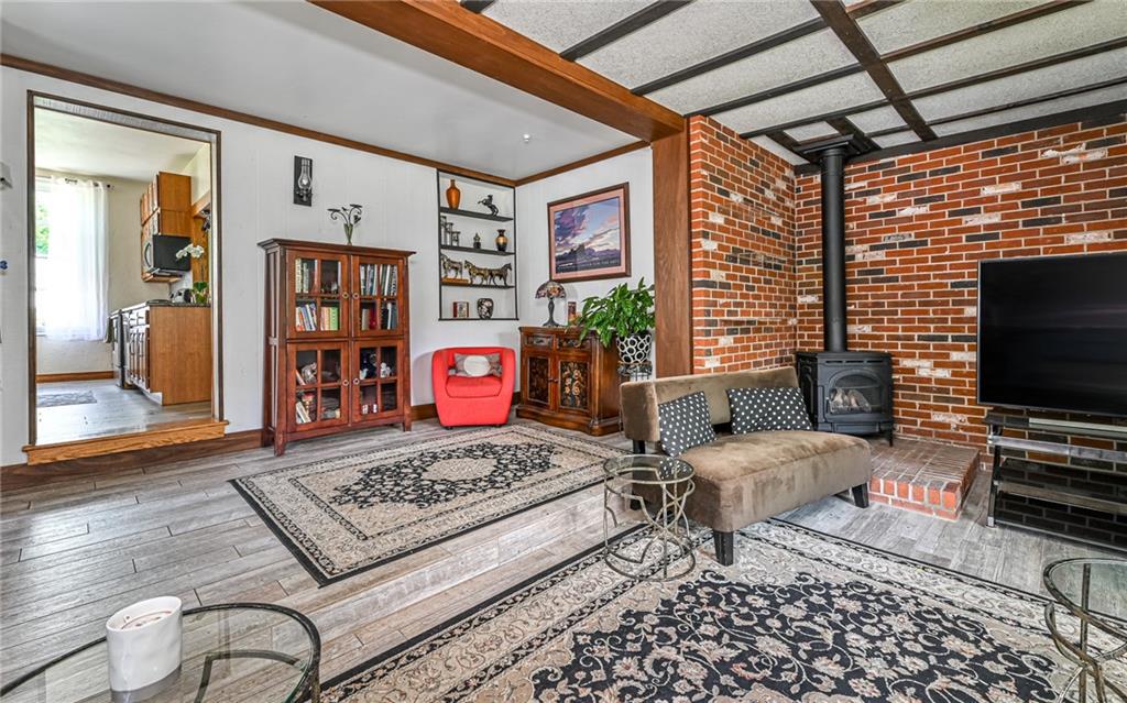 381 Friday Road Pittsburgh, PA 15209 - Photo 32 of 44 a living room with furniture and a flat screen tv